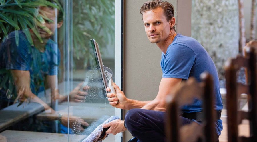Professional Window Cleaner Cleaning Windows